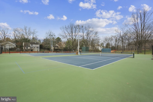 view of tennis court with fence