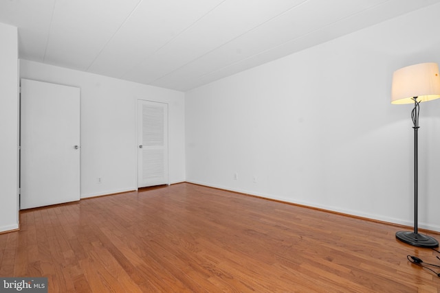 2648 Redcoat Dr Unit 99 1C, Alexandria, VA 22303 - unfurnished bedroom featuring wood finished floors and baseboards