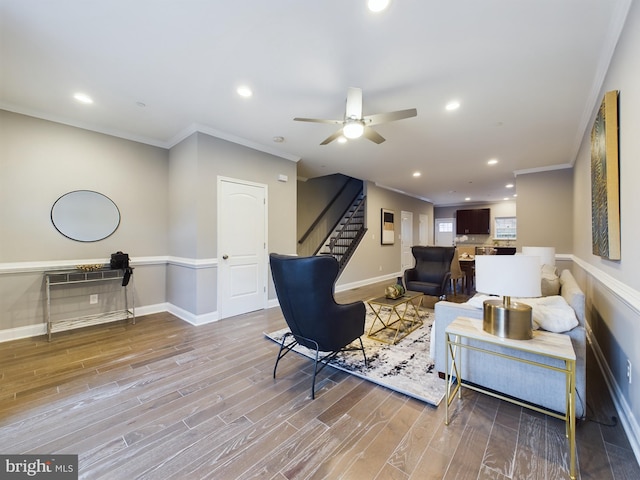 1519 E Chase St, Baltimore, MD 21213 - living room with ornamental molding, stairs, a ceiling fan, and wood finished floors