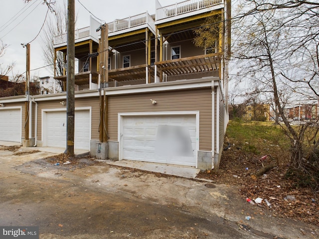 1519 E Chase St, Baltimore, MD 21213 - view of front of property featuring an attached garage and a balcony
