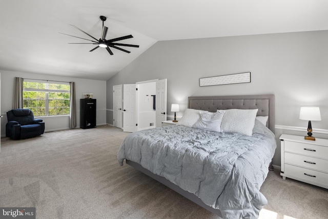 bedroom with baseboards, carpet flooring, a ceiling fan, and vaulted ceiling
