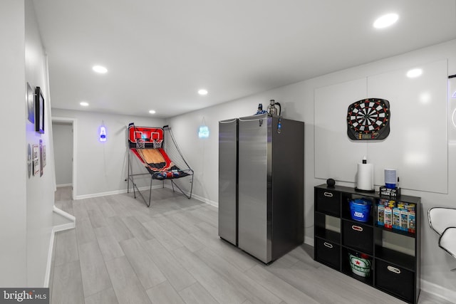 kitchen with freestanding refrigerator, recessed lighting, baseboards, and light wood-type flooring