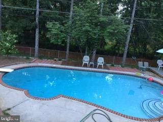 view of pool with a patio area, a fenced backyard, and a fenced in pool