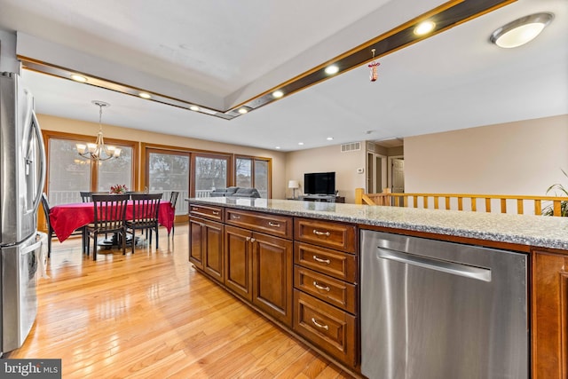 kitchen with light wood-style flooring, visible vents, an inviting chandelier, recessed lighting, and appliances with stainless steel finishes