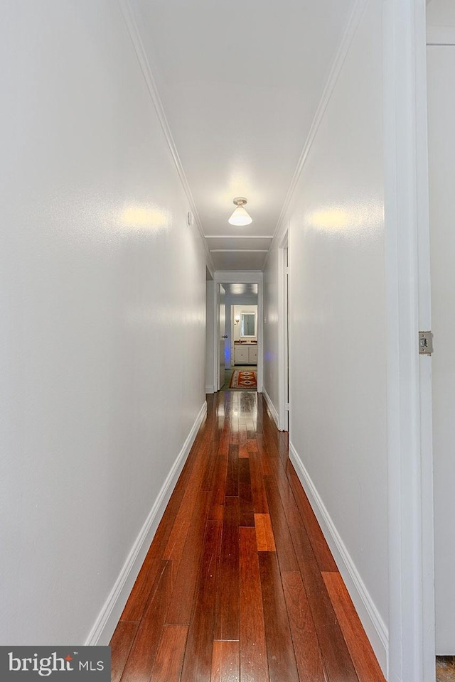 7010 Dover Ave, North Beach, MD 20714 - corridor with dark wood finished floors, baseboards, and ornamental molding