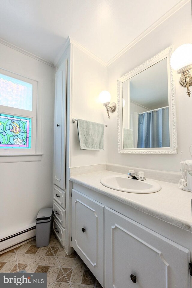 7010 Dover Ave, North Beach, MD 20714 - bathroom featuring ornamental molding, vanity, and a baseboard radiator