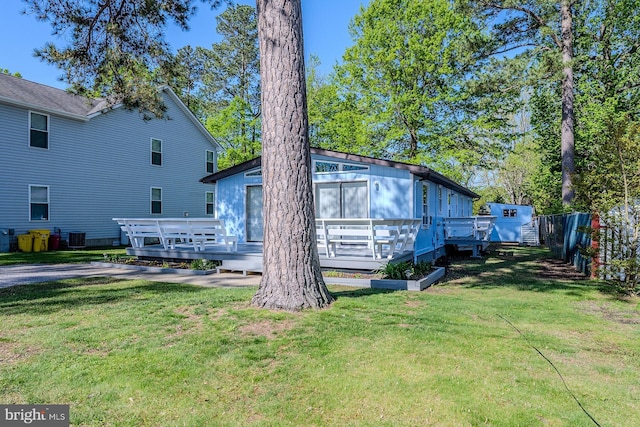 7010 Dover Ave, North Beach, MD 20714 - view of front of property featuring a deck and central air condition unit