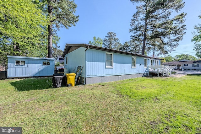 7010 Dover Ave, North Beach, MD 20714 - rear view of house featuring a yard and an outdoor structure