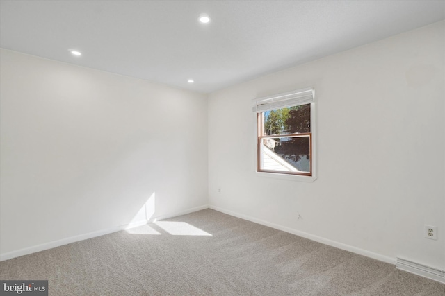 unfurnished room featuring baseboards, carpet flooring, and recessed lighting