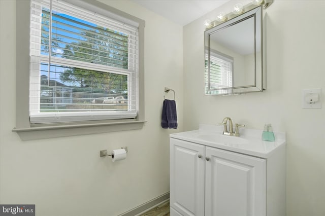 bathroom featuring vanity and baseboards