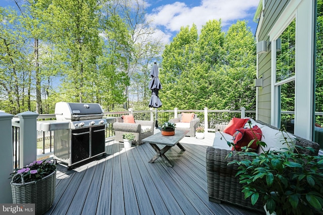 41972 Paddock Gate Pl, Ashburn, VA 20148 - wooden deck with an outdoor living space and a grill