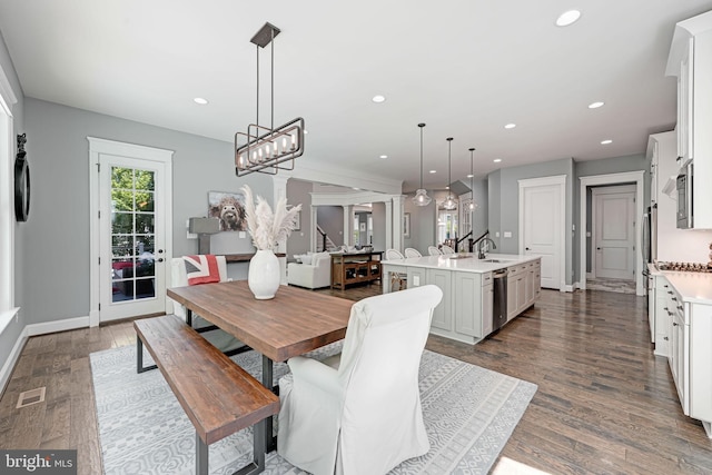 41972 Paddock Gate Pl, Ashburn, VA 20148 - dining space with dark wood-style flooring, recessed lighting, baseboards, and a chandelier