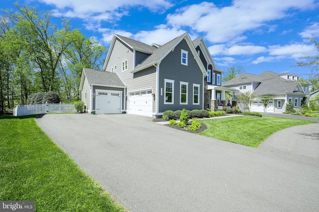 41972 Paddock Gate Pl, Ashburn, VA 20148 - view of front of house featuring asphalt driveway, an attached garage, and a shingled roof
