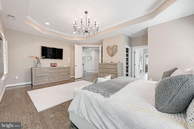41972 Paddock Gate Pl, Ashburn, VA 20148 - bedroom featuring a raised ceiling, wood finished floors, baseboards, crown molding, and a chandelier