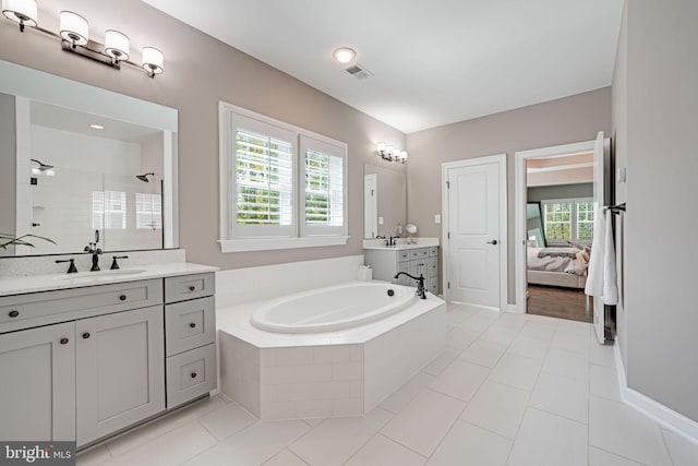 41972 Paddock Gate Pl, Ashburn, VA 20148 - bathroom with a tile shower, a bath, tile patterned floors, ensuite bathroom, and two vanities
