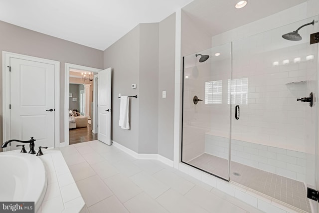 41972 Paddock Gate Pl, Ashburn, VA 20148 - full bathroom featuring a shower stall, connected bathroom, baseboards, a bath, and recessed lighting