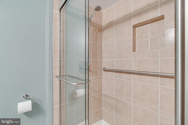 bathroom with a shower stall