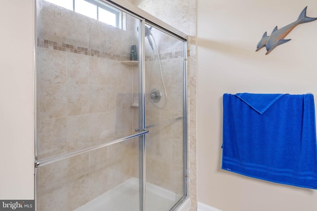 full bath featuring a tile shower