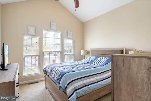 bedroom featuring lofted ceiling, light colored carpet, visible vents, ceiling fan, and baseboards