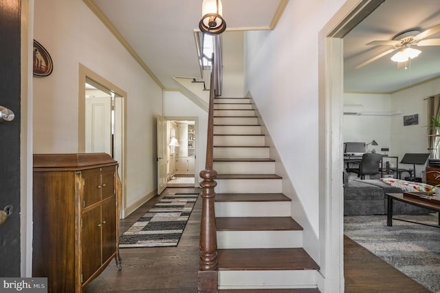 stairway featuring an AC wall unit, ceiling fan, ornamental molding, and wood finished floors
