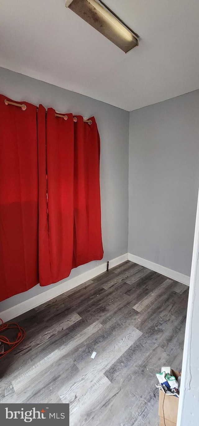 2641 N Bouvier St, Philadelphia, PA 19132 - spare room with baseboards and wood finished floors