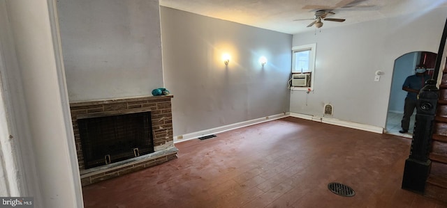 2641 N Bouvier St, Philadelphia, PA 19132 - unfurnished living room with hardwood / wood-style flooring, visible vents, cooling unit, a fireplace, and a ceiling fan