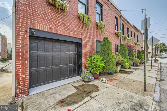 3223 Elliott St, Baltimore, MD 21224 - exterior space with an attached garage