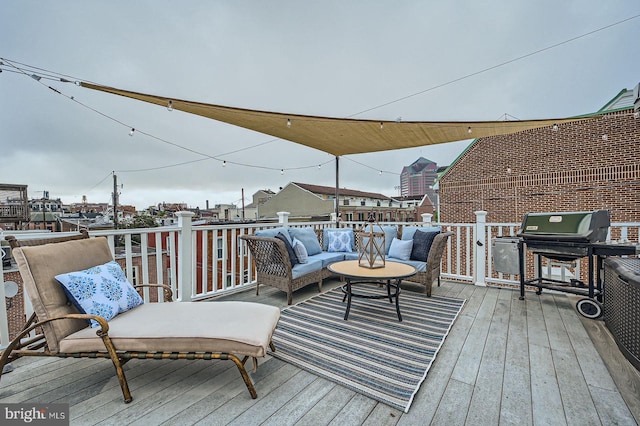 3223 Elliott St, Baltimore, MD 21224 - wooden deck with grilling area and an outdoor hangout area