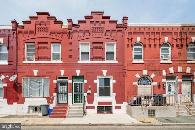 2227 Page St, Philadelphia, PA 19121 - view of front facade with brick siding, cooling unit, and entry steps