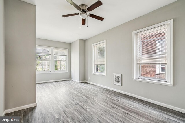 2227 Page St, Philadelphia, PA 19121 - empty room featuring ceiling fan, baseboards, visible vents, and wood finished floors