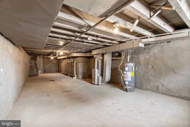 2227 Page St, Philadelphia, PA 19121 - unfinished basement with stairs, heating unit, and gas water heater