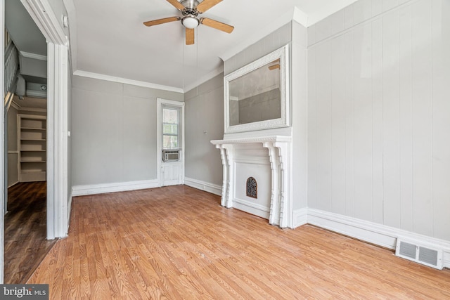 2227 Page St, Philadelphia, PA 19121 - unfurnished living room with visible vents, ornamental molding, light wood-style floors, and ceiling fan