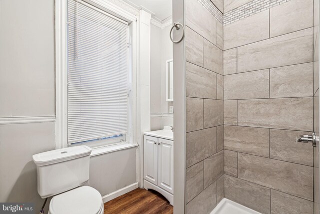 2227 Page St, Philadelphia, PA 19121 - bathroom with crown molding, toilet, wood finished floors, and vanity