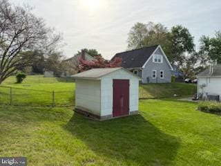 view of shed with fence