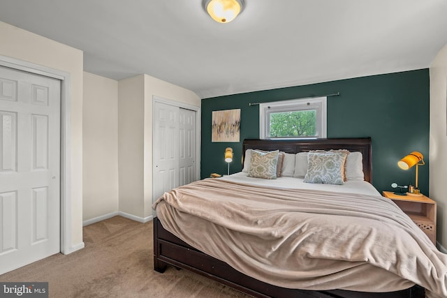 6842 Queens Ferry Rd, Baltimore, MD 21239 - carpeted bedroom featuring a closet, baseboards, and lofted ceiling