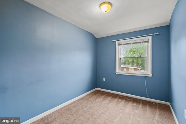6842 Queens Ferry Rd, Baltimore, MD 21239 - spare room featuring carpet, baseboards, and lofted ceiling