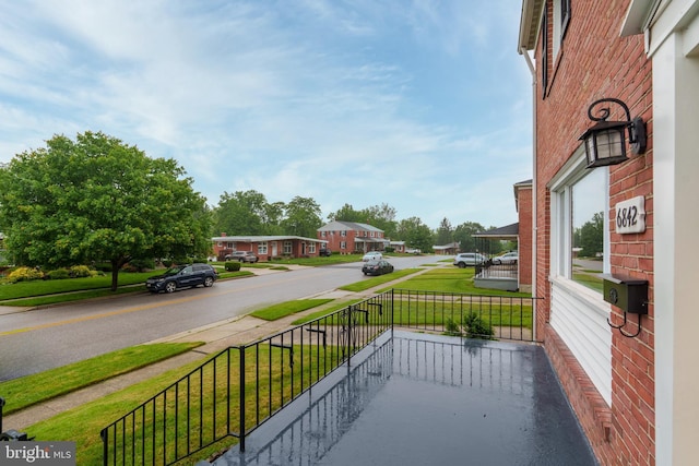 6842 Queens Ferry Rd, Baltimore, MD 21239 - porch featuring a residential view and a yard