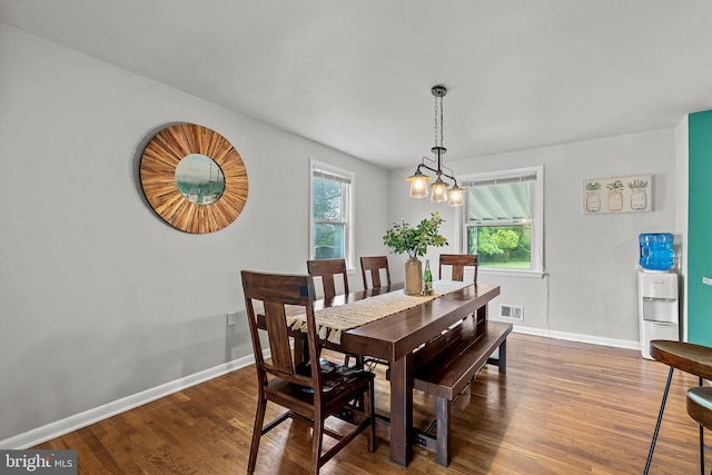 6842 Queens Ferry Rd, Baltimore, MD 21239 - dining space with wood finished floors, plenty of natural light, and baseboards