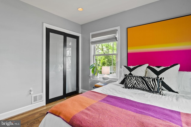 2006 Scroggins Rd, Alexandria, VA 22302 - bedroom featuring baseboards, wood finished floors, and visible vents