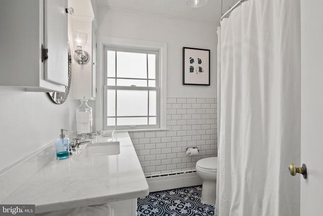 2006 Scroggins Rd, Alexandria, VA 22302 - bathroom with tile walls, wainscoting, tile patterned floors, a baseboard heating unit, and toilet