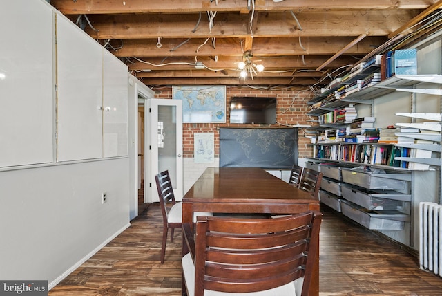 2006 Scroggins Rd, Alexandria, VA 22302 - basement featuring radiator heating unit, baseboards, and wood finished floors