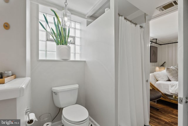 2006 Scroggins Rd, Alexandria, VA 22302 - ensuite bathroom with wood finished floors, toilet, ensuite bath, and visible vents