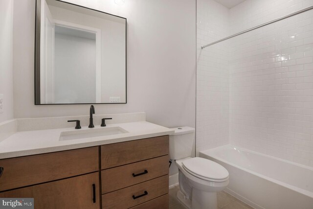 bathroom with toilet, vanity, and shower / bathing tub combination
