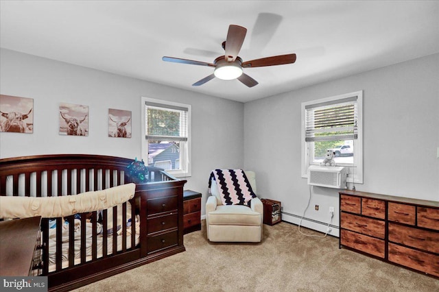 bedroom with a baseboard heating unit, multiple windows, carpet floors, and cooling unit
