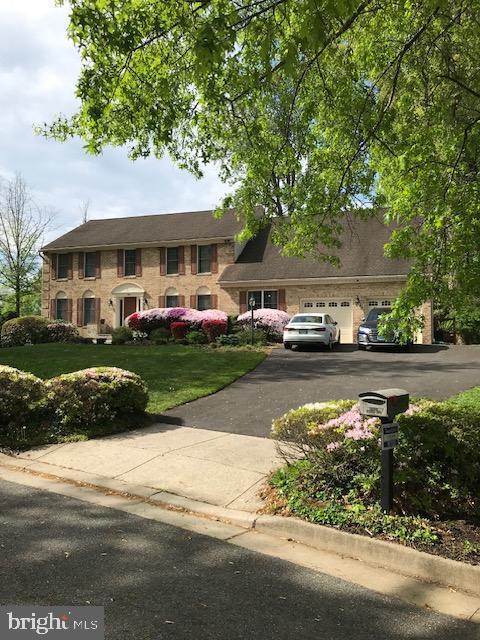 10120 Frost Way, Ellicott City, MD 21042 - view of property with asphalt driveway and a garage