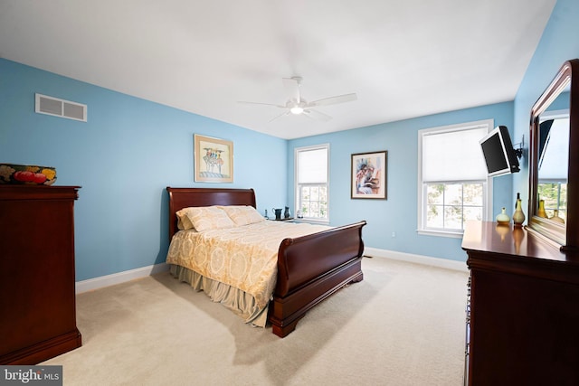 bedroom featuring visible vents, carpet flooring, baseboards, and ceiling fan