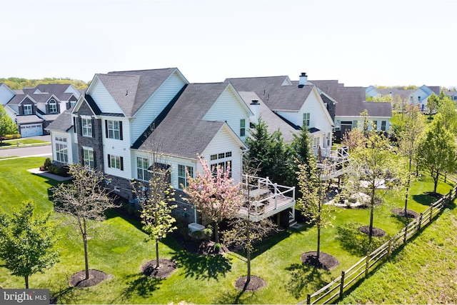 birds eye view of property with a residential view