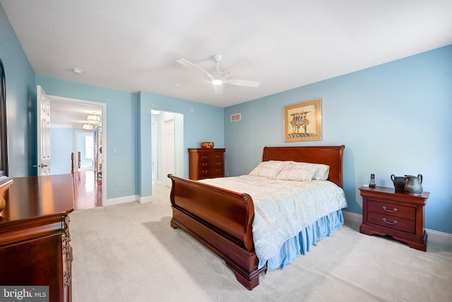 bedroom featuring carpet floors, baseboards, ceiling fan, and visible vents