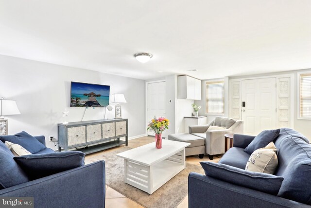 living area featuring baseboards