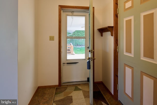 entryway featuring baseboards